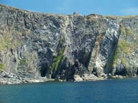KG091884 cliffs rocks people castle